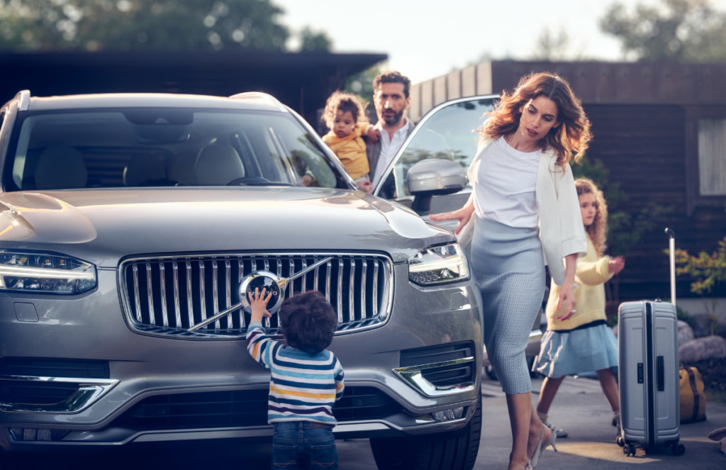 Family getting into volvo car
